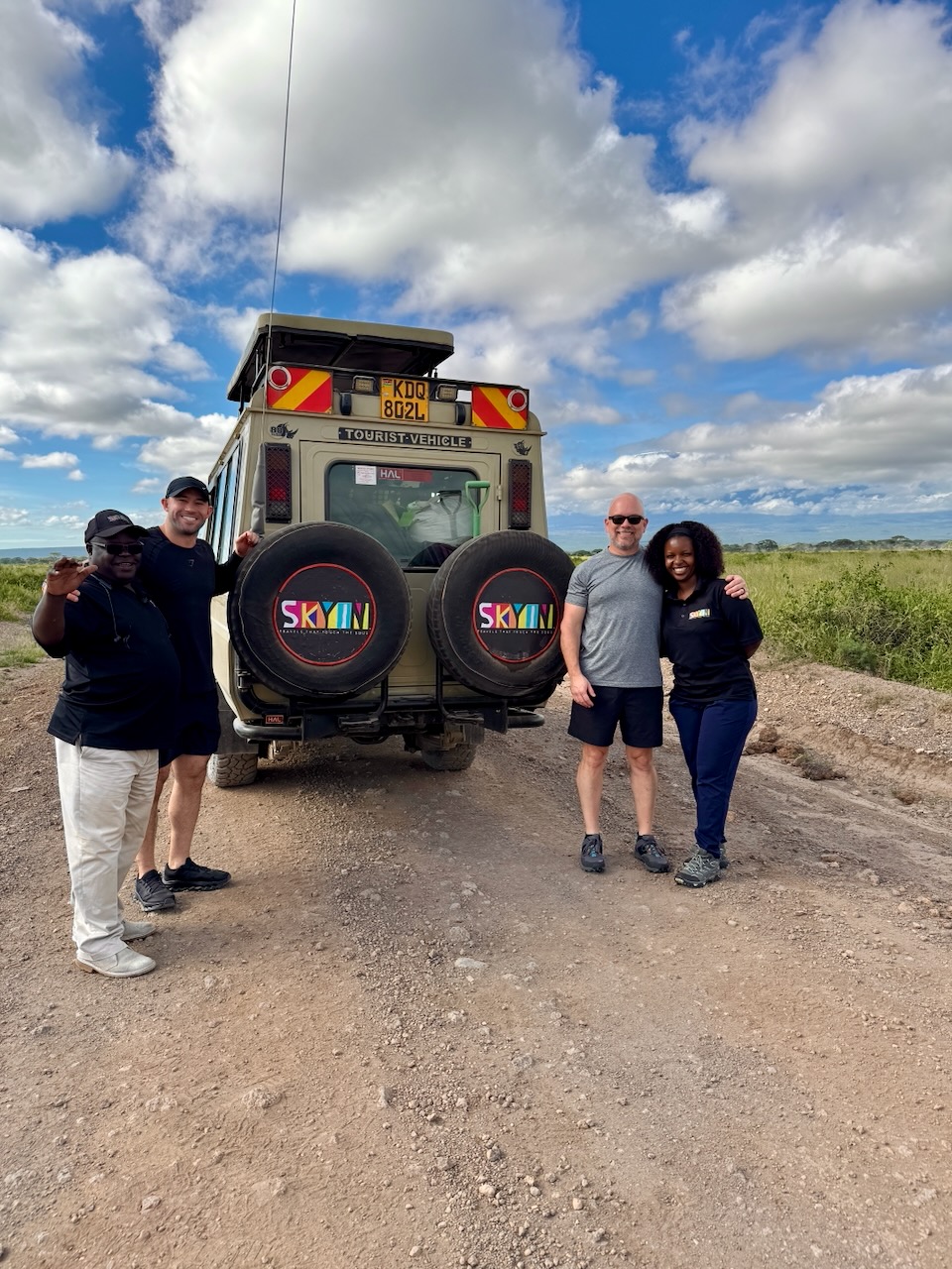 Trey with SKYIN Team by SKYIN safari vehicle