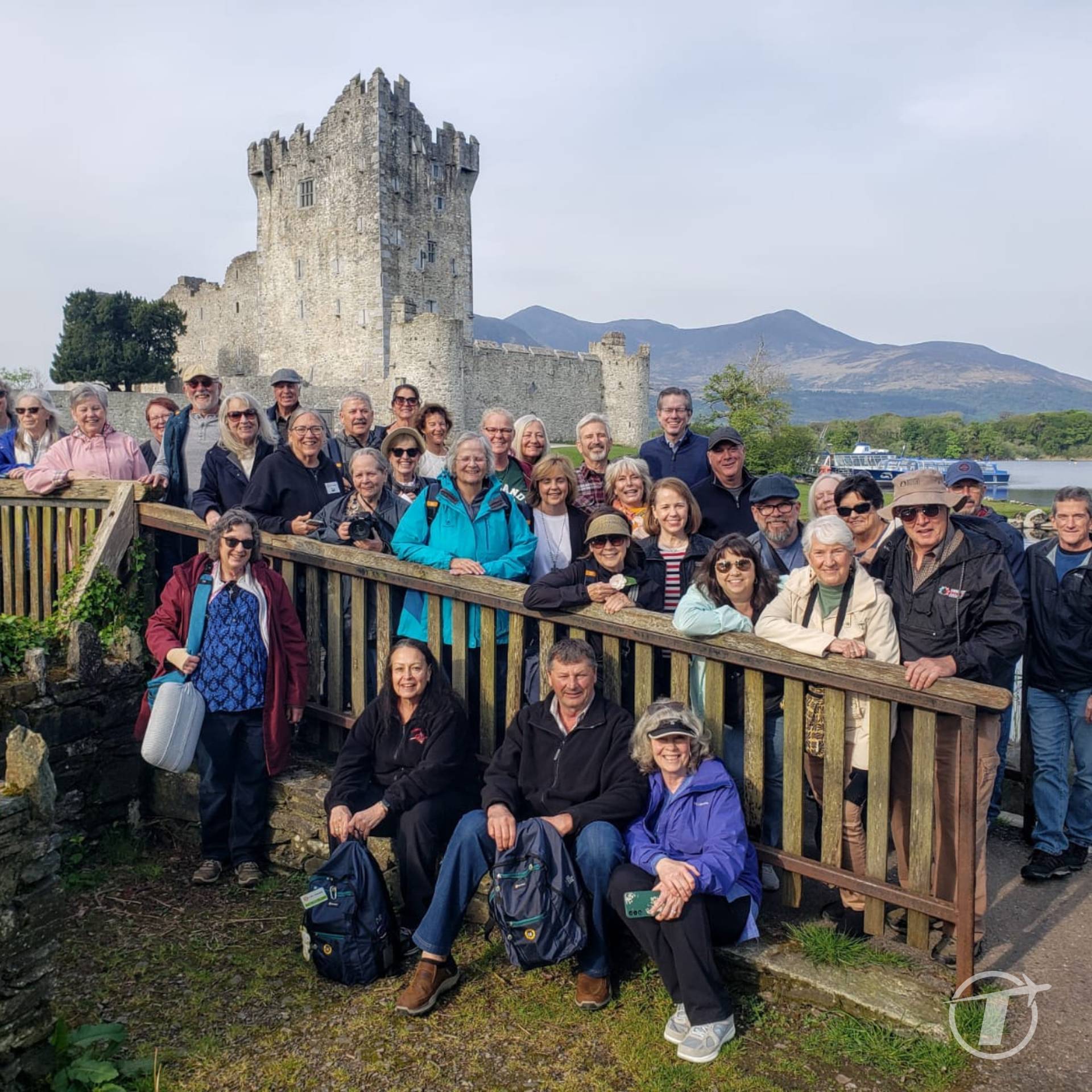 Mixed Group of Travelers in Front of Ross Castle in Ireland Mixed Group of Travelers in Front of Ross Castle in Ireland